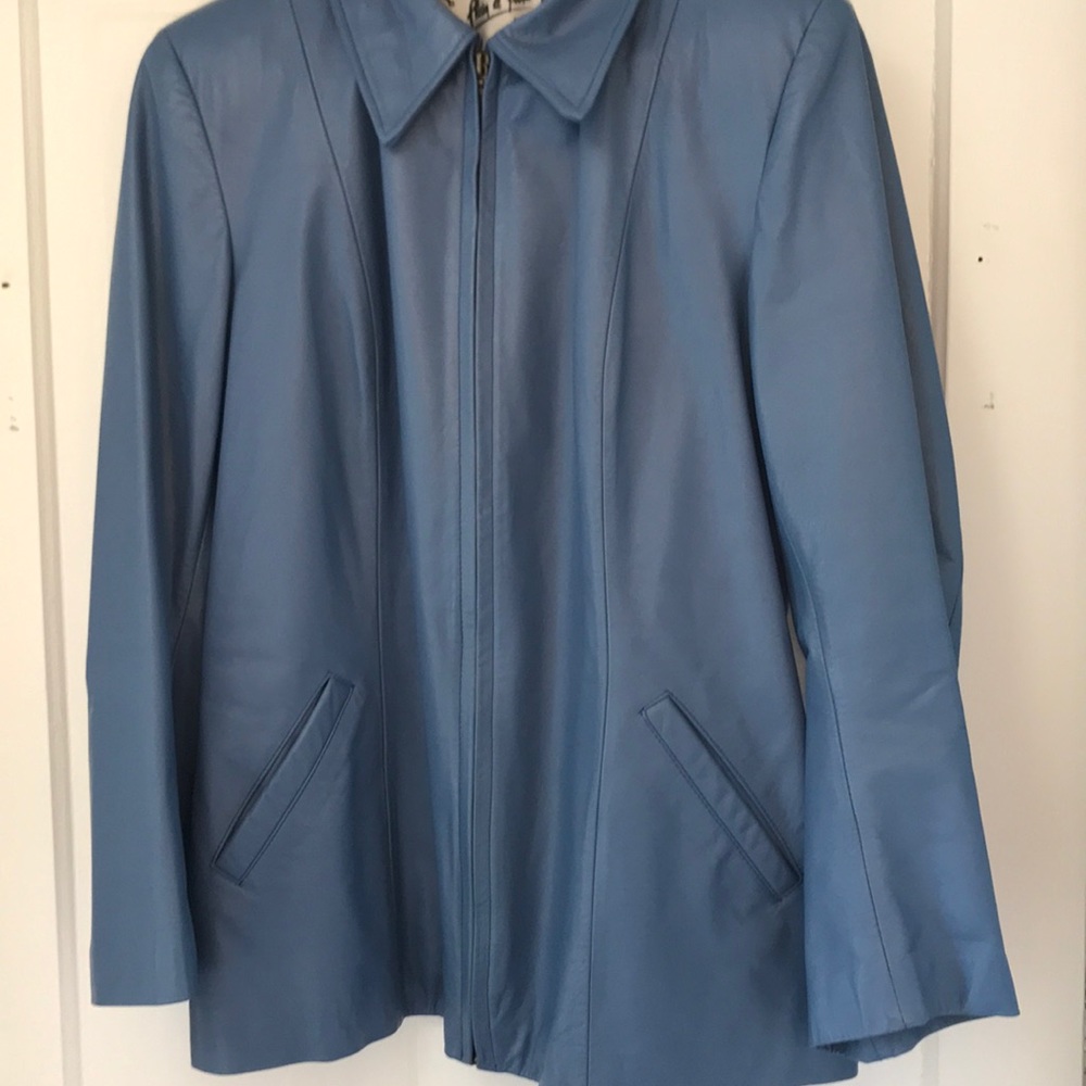 Women’s light to medium blue leather jacket.